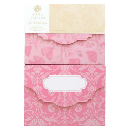 a pink envelope with a white label on it.