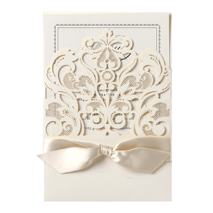 a white wedding card with a bow.