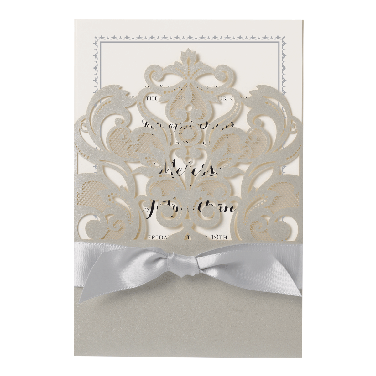 a white wedding card with a silver bow.