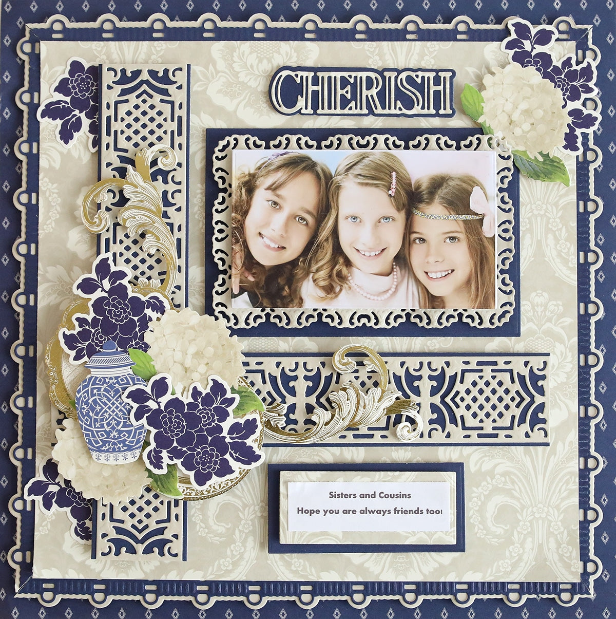 a blue and white picture frame with a picture of two girls.