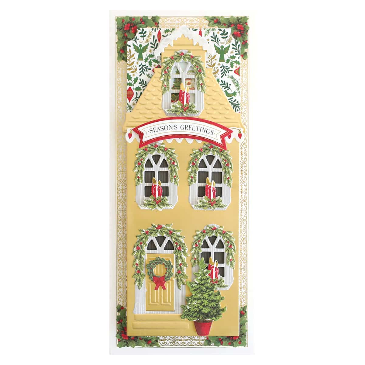 a christmas card with a yellow house and wreaths.