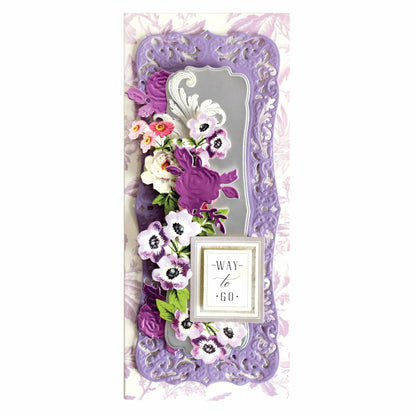 a picture frame with flowers and a clock on it.