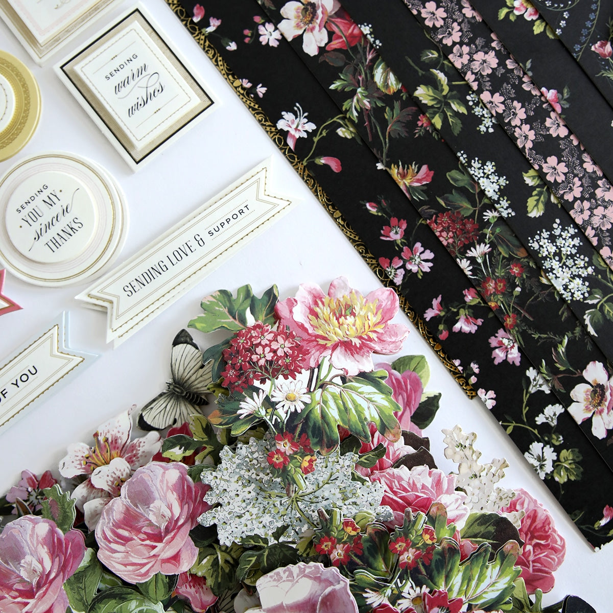 a table topped with lots of different types of flowers.