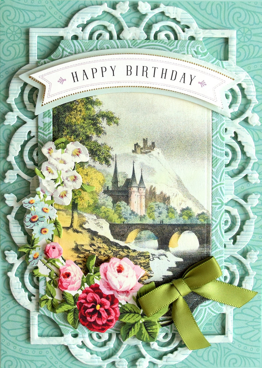 a birthday card with flowers and a castle.
