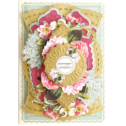 a pink and gold Celebration Cartouche Cut & Emboss Folder with flowers on it.