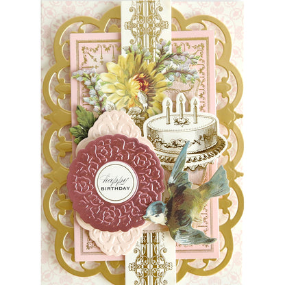 a pink and gold Celebration Cartouche Cut & Emboss Folder with a bird and flowers.
