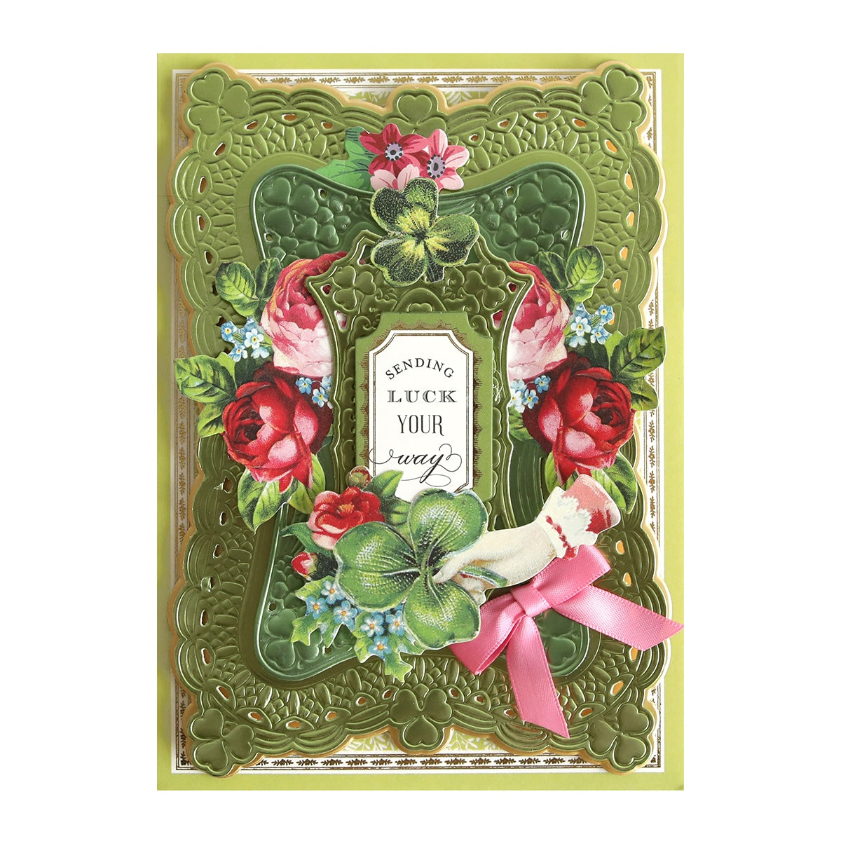 a green card with flowers and a pink ribbon.