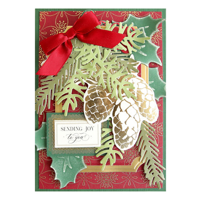 a christmas card with pine cones and a red bow.