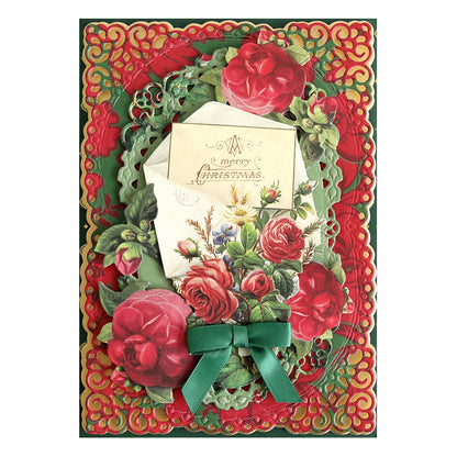 a christmas card with red roses and a green bow.