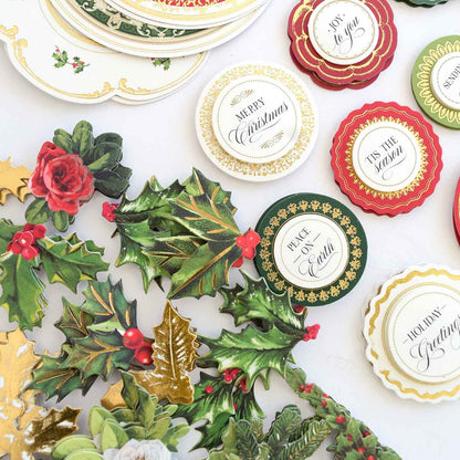 a table topped with lots of plates covered in christmas decorations.