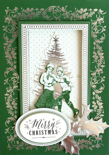 a christmas card with a picture of two people hugging.