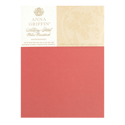 a piece of red paper with a gold border.