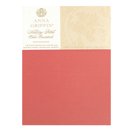 a piece of red paper with a gold border.