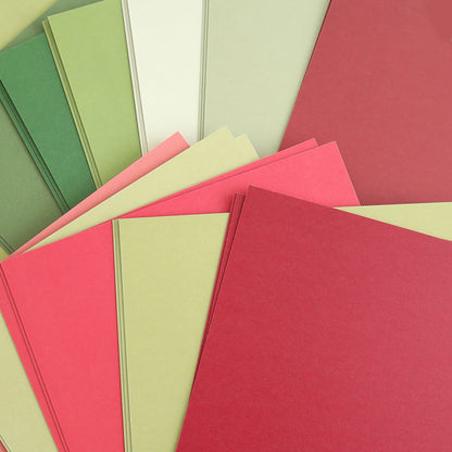 a bunch of different colors of paper on a table.