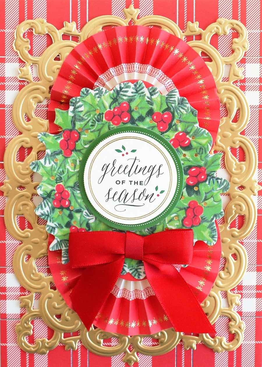 a close up of a christmas card with a red bow.