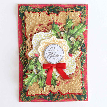 a christmas card with a red ribbon and a holiday decoration.