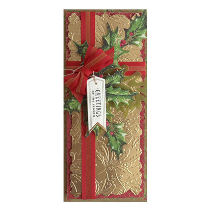 a christmas card with a red ribbon and holly.