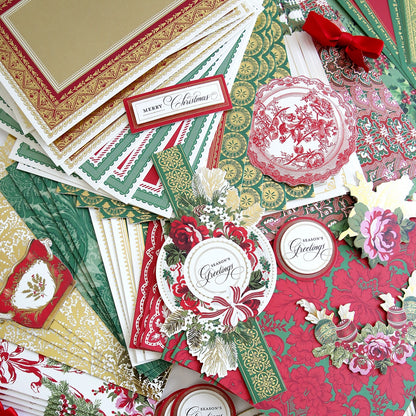 A pile of Christmas Wishes Card Making Kit and papers.