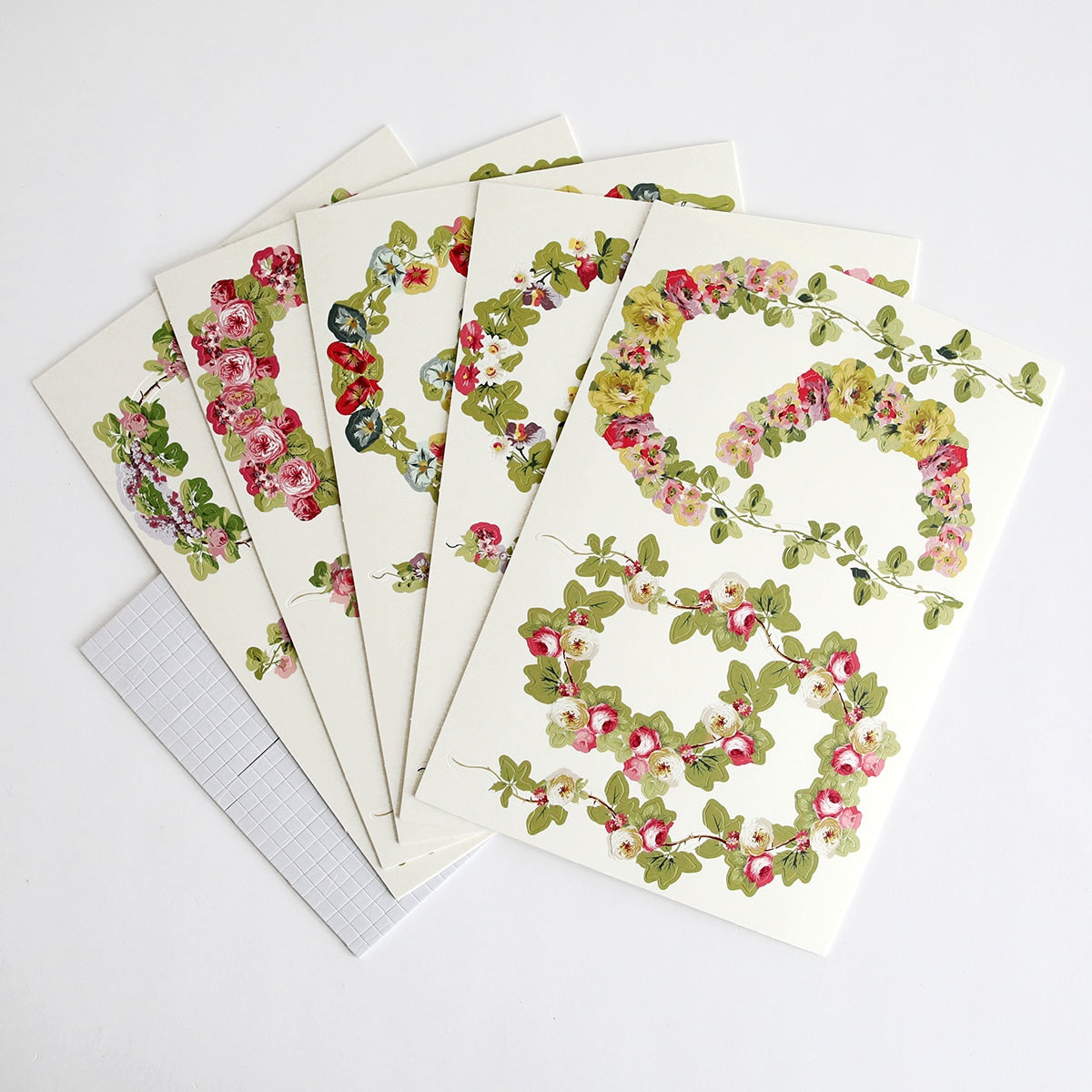 a bunch of cards that have flowers on them.