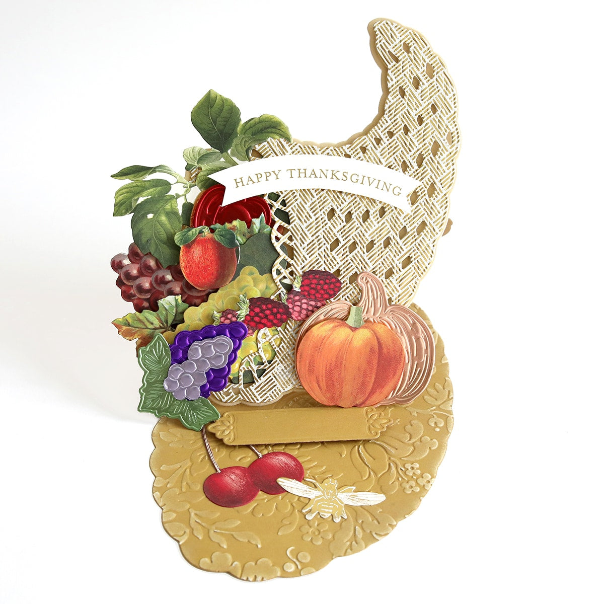 A Cornucopia Easel Card Dies with fruits and vegetables on it.
