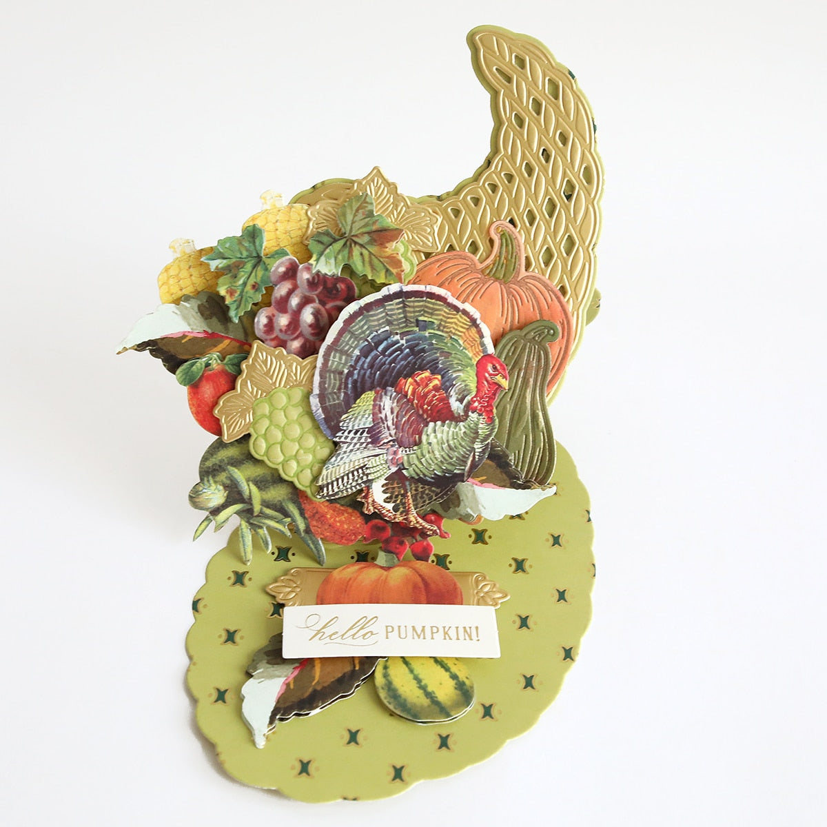 A Cornucopia Easel Card Dies with a turkey and vegetables on it.