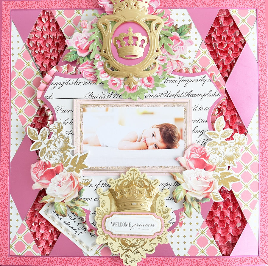 a pink and gold card with a picture of a baby.