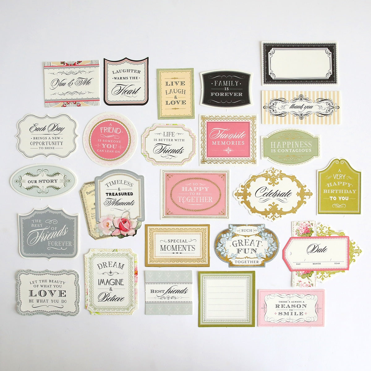 A variety of Eleanor Diecut Titles labels and tags arranged on a white surface.