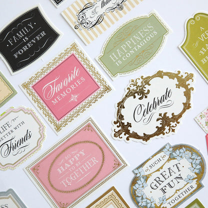A collection of different Eleanor Diecut Titles labels and stickers on a white surface.