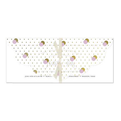 a white and gold dotted paper with dots on it.