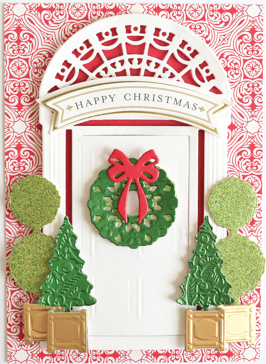 a christmas card with a green wreath and a red bow.