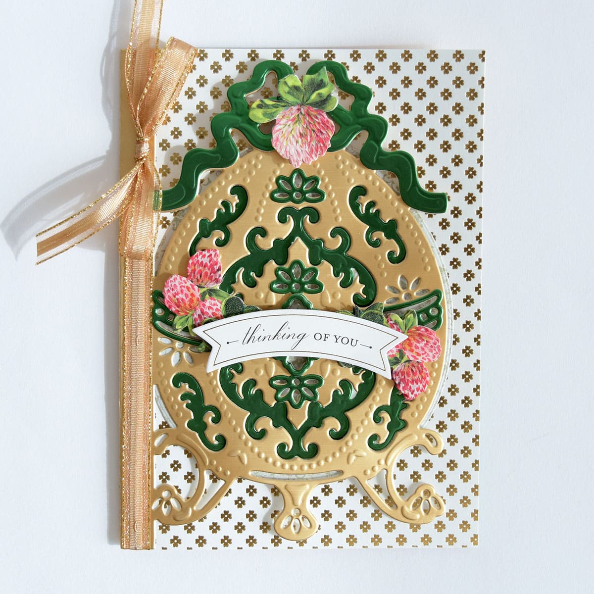 a close up of a card with a ribbon.