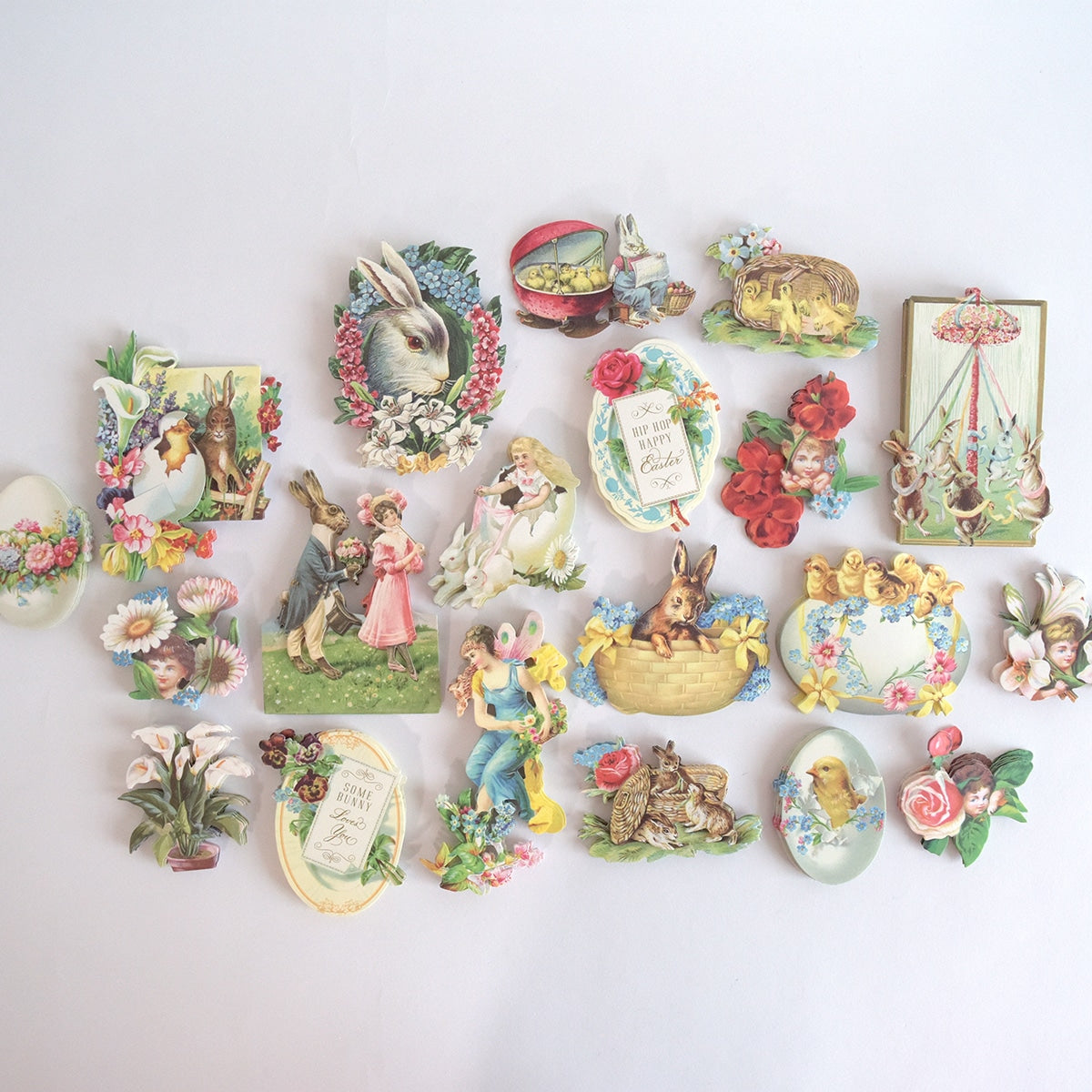 a collection of vintage easter decorations on a white background.