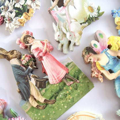 a table topped with figurines of people and animals.