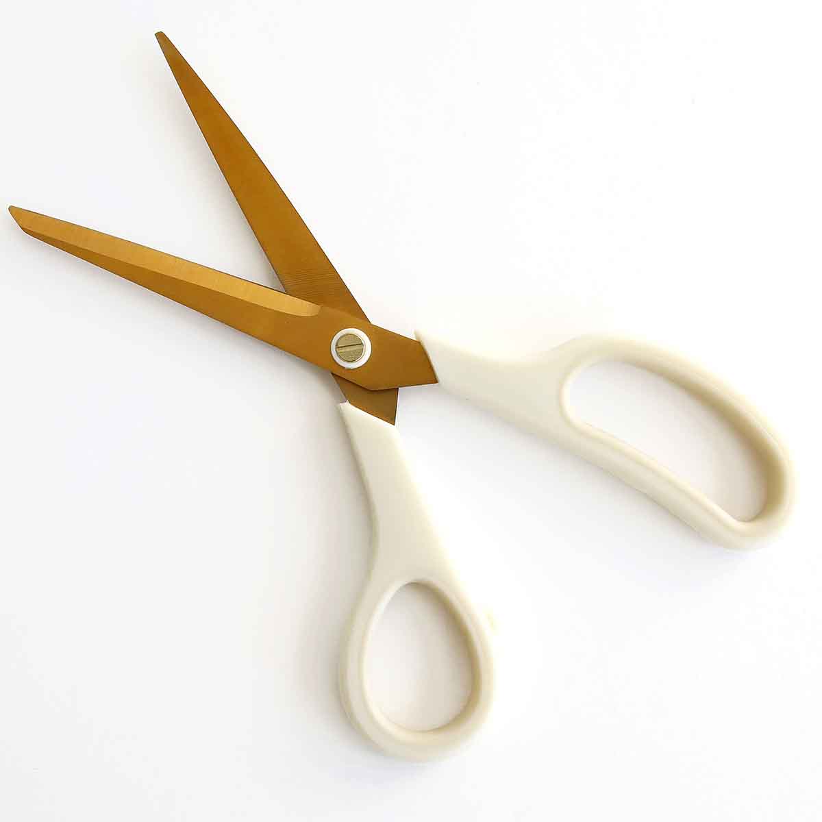 a pair of scissors sitting on top of a table.