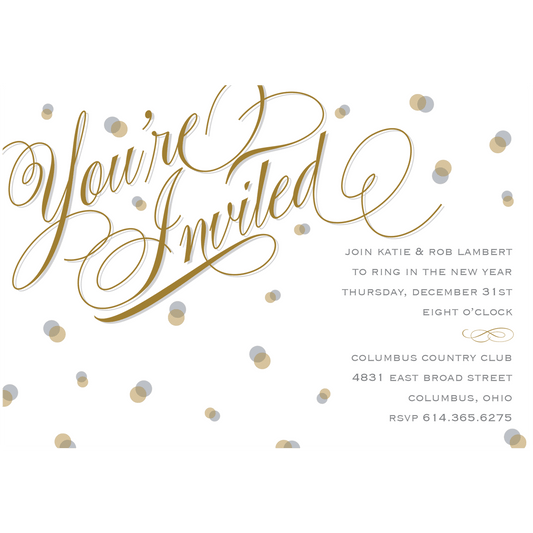 a white and gold wedding card with confetti.