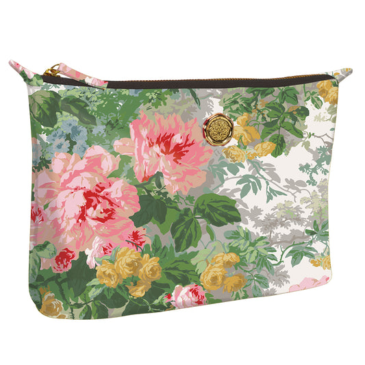 a floral print purse with a gold button.