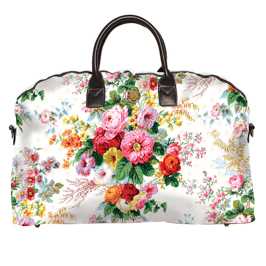 a white floral bag with a black handle.