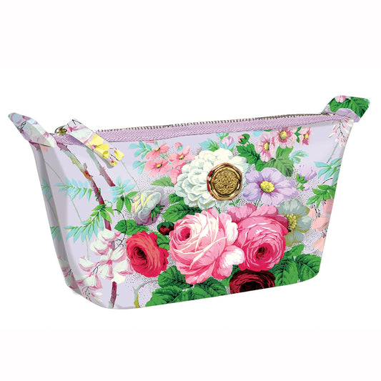 A pink and white Lillian Small Cosmetic Bag with flowers on it.