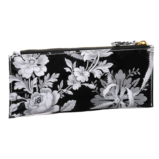 a black and white floral print purse.