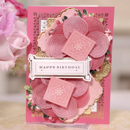 a close up of a birthday card with flowers.