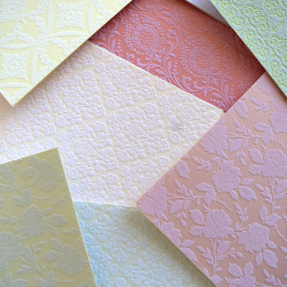 a close up of many different colors of paper.