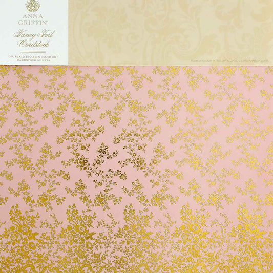 a close up of a pink and gold wallpaper.