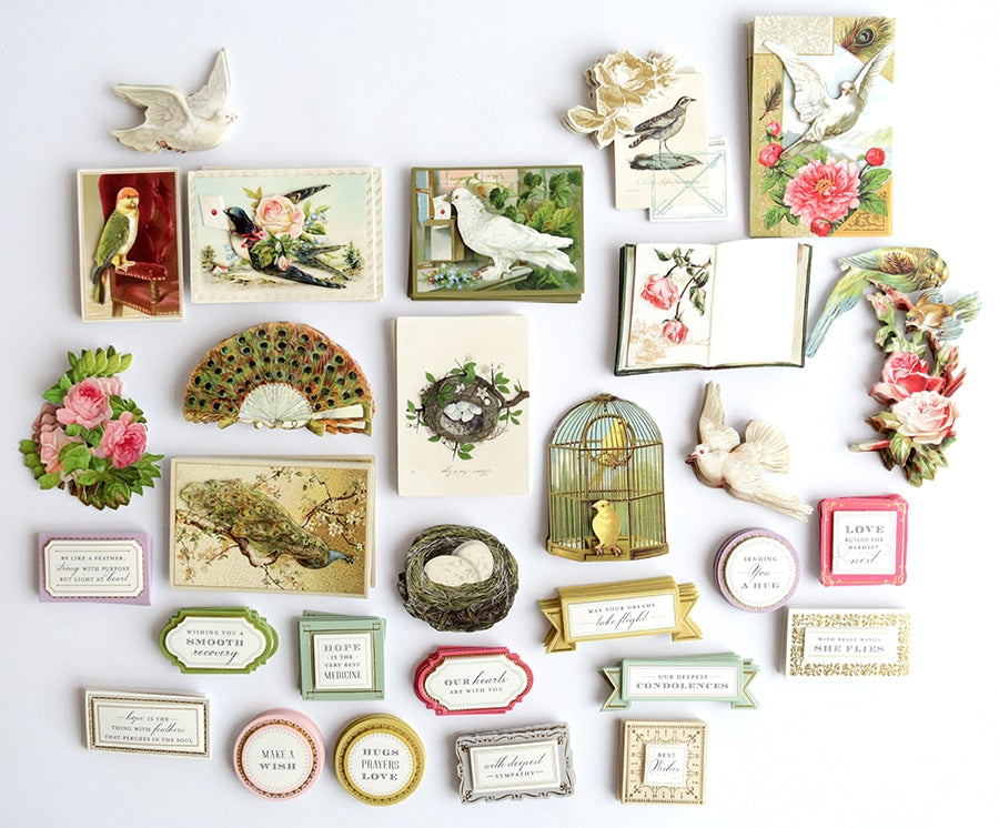 a white wall covered in lots of different types of cards.