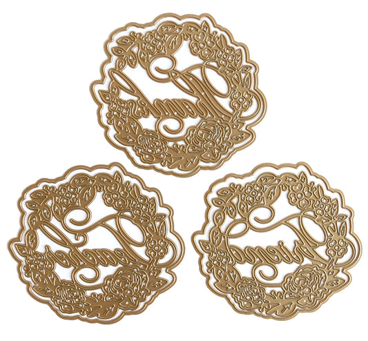 a set of three metal coasters with arabic writing.