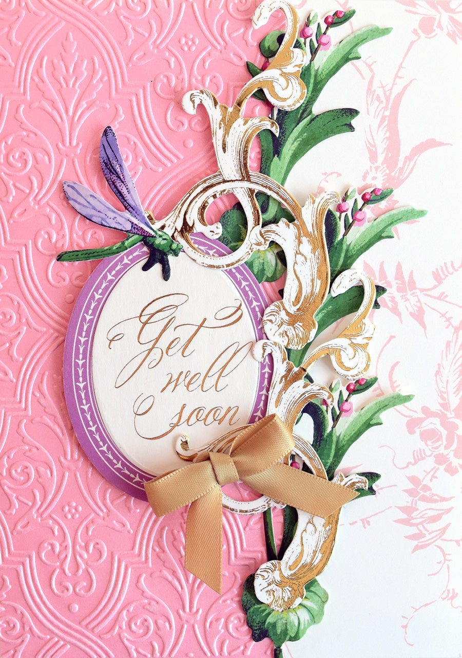 a close up of a greeting card on a pink background.