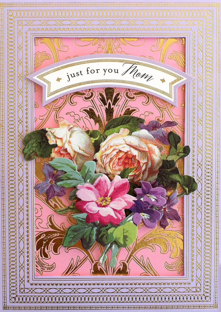 a pink card with a bouquet of flowers on it.