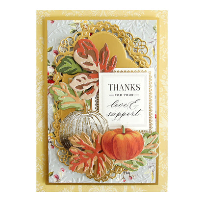 a thanksgiving card with a pumpkin and leaves.