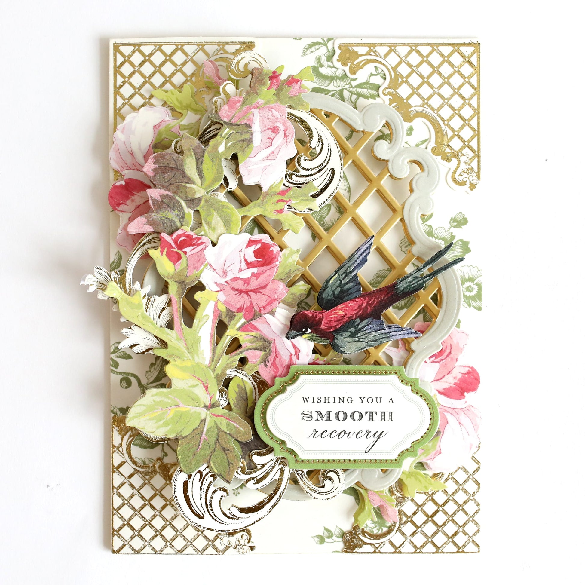 a close up of a card with flowers and birds.