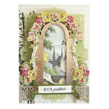 a card with a picture of a castle and flowers.