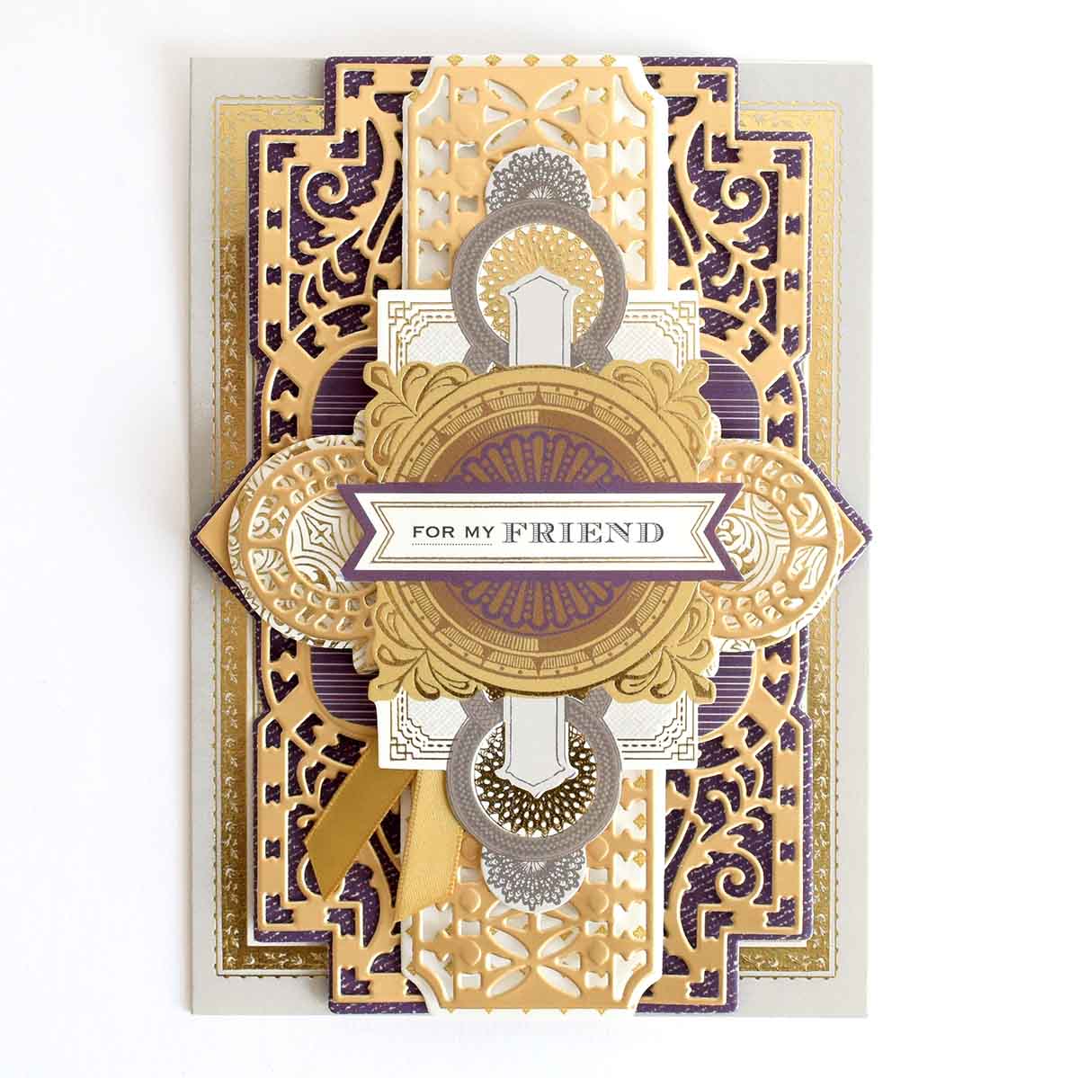 a card with a gold and purple design on it.
